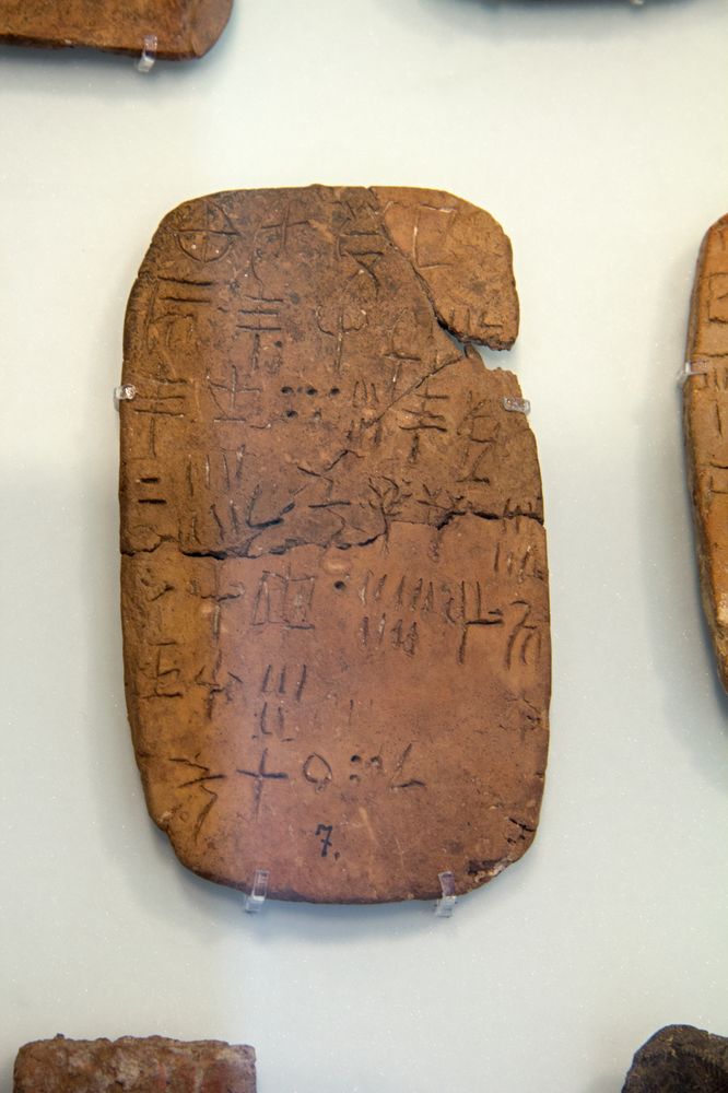 A small clay tablet from Crete covered in Linear A signs that no one can yet read as a language.